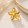 Bague Fleur Dorée Ajustable en Acier Titane