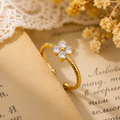 Bague Trèfle Éclat en Acier Titane Doré